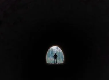 Man walking through Dingess Tunnel